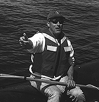 Stormy Mayo of the Center for Coastal Studies prepares to attempt to remove fishing gear from an endangered North Atlantic right whale. Mayo was with a group of whale researchers and disentanglement experts that encountered the entangled animal in the Bay of Fundy on June 5.