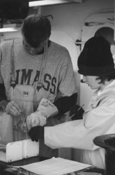 Image: John Burnett of NEFSC's Woods Hole lab collects otoliths (bone-like material that indicates the age of a fish) to be examined at the lab for age and growth information. Stacy Burgh of NEFSC's Milford, Connecticut lab assists with sampling and logs information.