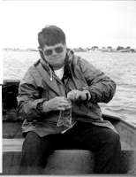 Image: Ann Reid, Coordinator of Great Bay Watch, a citizen monitoring group on the New Hampshire seacoast, collects a water sample in Hampton Harbor. Great Bay Watch is working with state agencies to monitor water quality in shellfish harvesting areas.