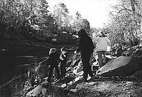 Seventh-grade students from Ipswitch, Massachusetts sample the Ipswitch River for the presence of fecal coliform as part of a project of the Ipswitch River Watershed Association, which has received some funding from the Gulf of Maine Council.